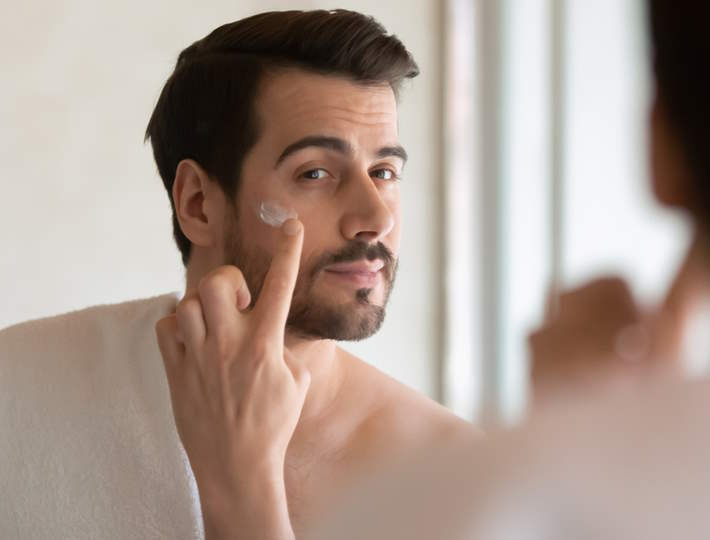Skincare for Men: A Beginner's Perspective, Millennial,Handsome,Man,Looking,In,Mirror,,Applying,Moisturizing,After,Shaving